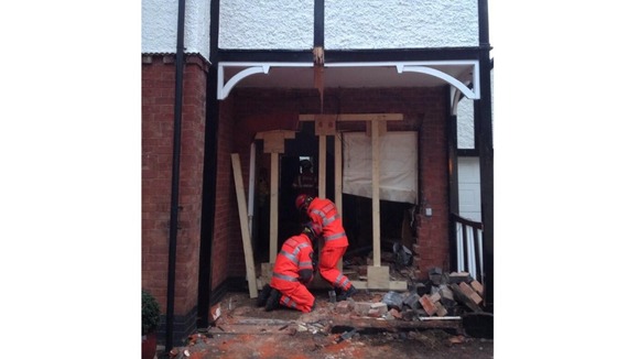 The house had to be shored up with wooden joists after the crash.