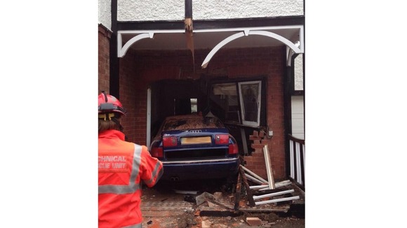 The car ended up in the house's hallway.