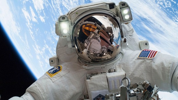 NASA astronaut Rick Mastracchio is reflected in this picture taken of fellow ISS astronaut Mike Hopkins