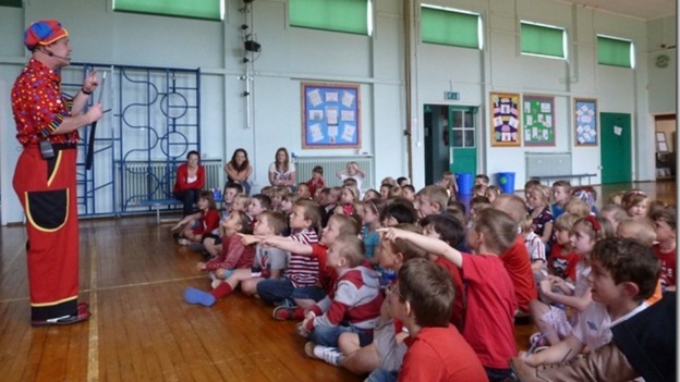 Magician in school hall