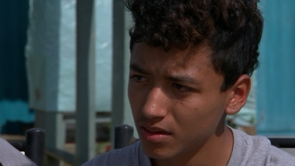 This 14-year-old boy is getting ready to work in the tobacco fields this summer.