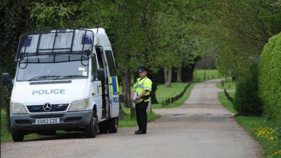 Police seen at Down Hall Country House in Essex last year.
