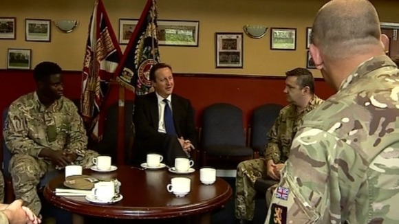 David Cameron speaks with soldiers during the first day of his visit to Scotland.