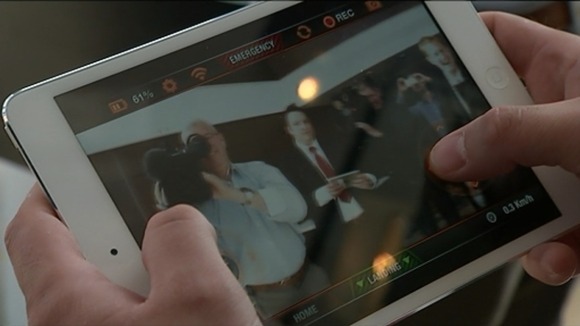 A tablet showing the cameraman filming the interview.