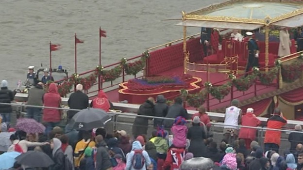 The Queen's boat passes under London Bridge