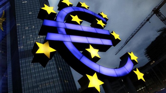 Euro sign in front of building