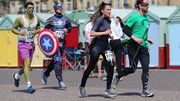 Runners compete in the Heroes and Villains charity race in Hove, East Sussex.