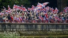 Royal revellers line the banks of the River Thames, during the Diamond Jubilee River Pageant, in London.