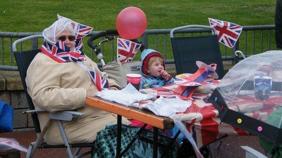 An elderly lady and little girl celebrate the Diamond Jubilee