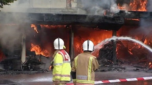 Fire crews outside the burning shop in Fakenham