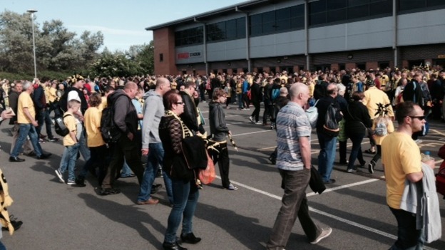 Fans gathered outside the Pirelli Stadium to catch coaches to Wembley