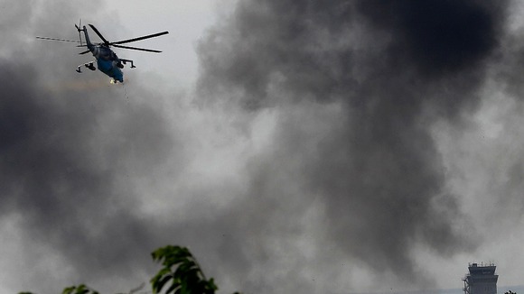 A helicopter flies over Donetsk after scenes of fighting.