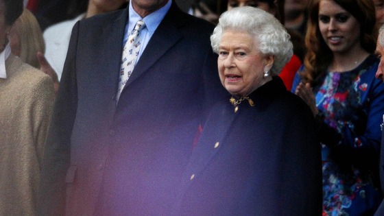 The Queen joins the audience just in time to see Robbie Williams peform