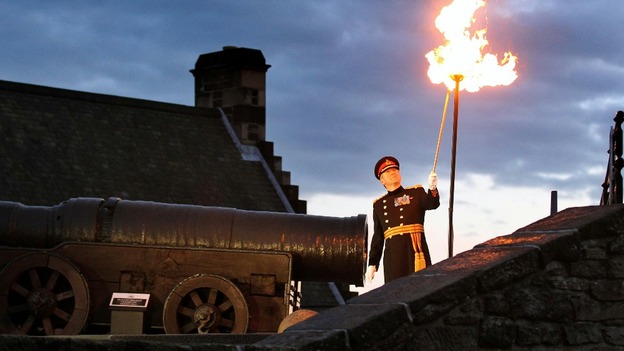 Major General Nick Eeles lights the Diamond Jubilee beacon at Edinburgh Castle