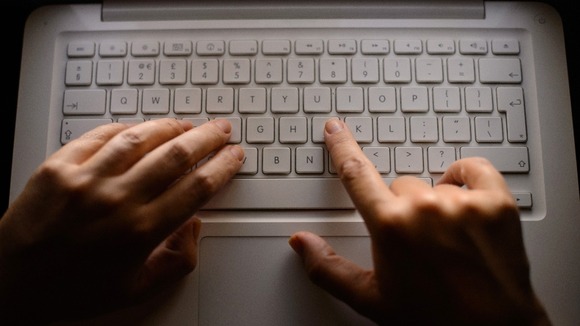 Fingers on a keyboard.