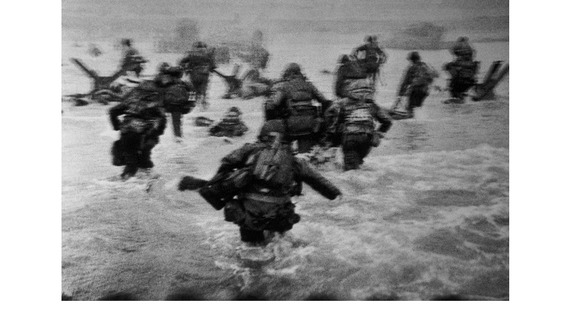 Capa's iconic image shows American troops landing on Ohama Beach on 6 June.