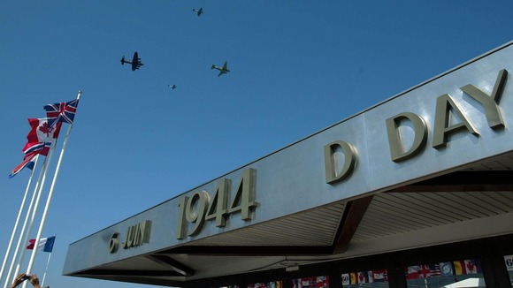 Aircraft from the Battle of Britain Memorial Flight pass over the D-Day museum in Arromanches, Normandy
