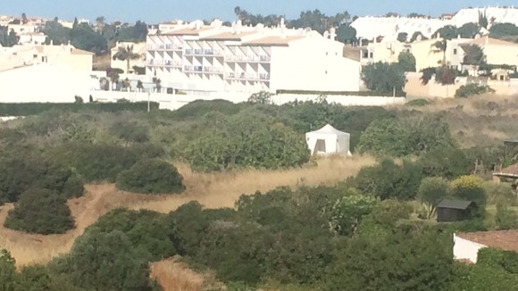 Police are searching a large area of waste land in Praia da Luz.