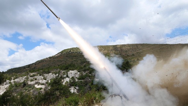 Rebel fighters fire a Grad rocket at forces Loyal to Bashar al-Assad.