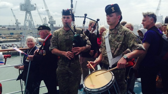 Music is played for the assembled veteran in Portsmouth.