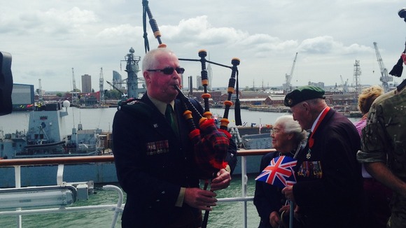 Music is played for the assembled veteran in Portsmouth.