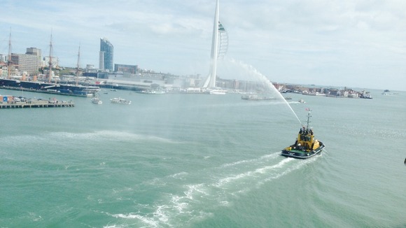 A water cannon salute as the ferry departs for Normandy.