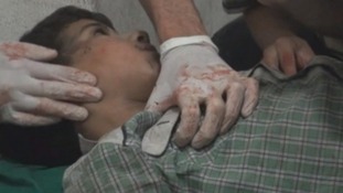 An 11-year-old fights for his life after being hit by a mortar less than ten miles from Damascus, rebels told ITV News.