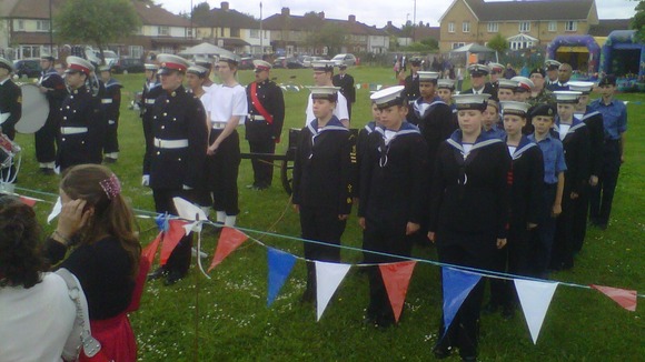 The cadets stand for the National Anthem.