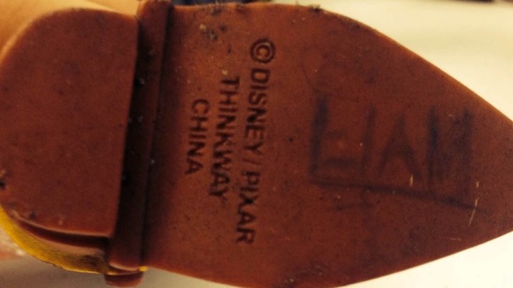 The doll has 'Liam' etched on his right foot.