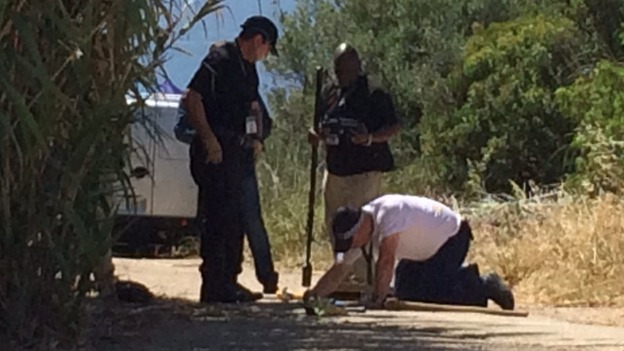 Police send cameras into the drains system under the wasteland in Praia da Luz.