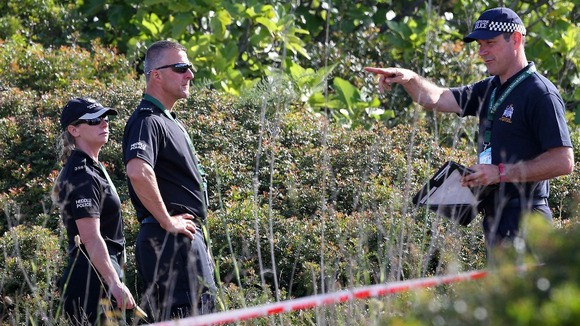 British police check an area of scrubland during the search for evidence of Madeleine McCann, in the town of Praia da Luz in Portugal.