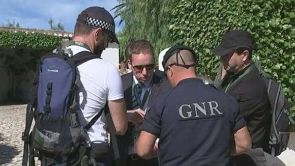 Police officers gather at the site in Praia da Luz in Portugal, in the search for Madeleine McCann.