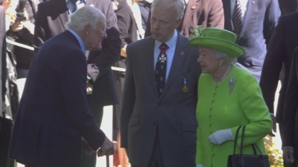 The Queen arrives at the Commonwealth War Graves Cemetery in Bayeux.