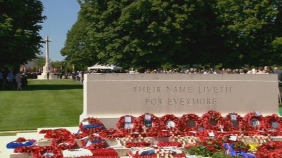 Wreaths placed at the memorial in Bayeux cemetery where the memorial service took place.