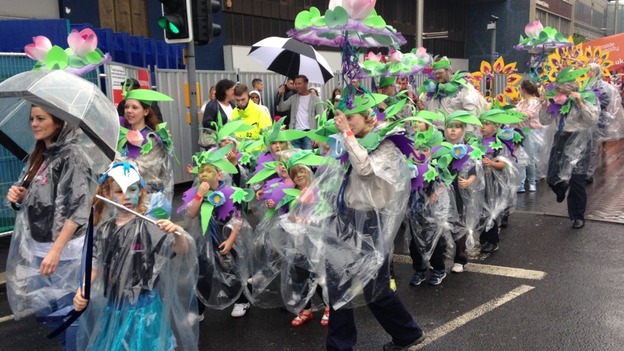 Umbrellas and raincoats keep out the worst of the June showers.