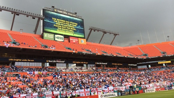 A sign announces the 30-minute suspension of play.