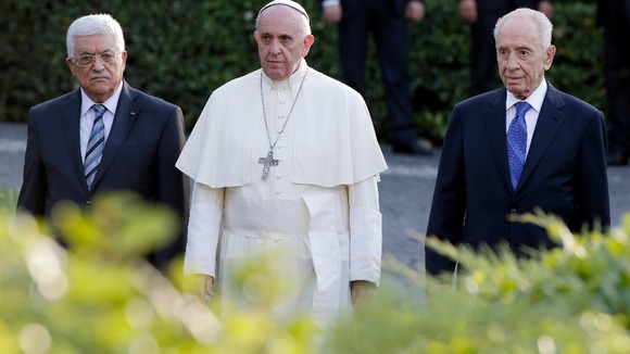 Palestinian President Mahmoud Abbas, Pope Francis and Israeli President Shimon Peres arrive in the Vatican Gardens.
