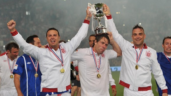 Paddy McGuinnes, John Bishop and Robbie Williams celebrate after 2012's Soccer Aid.