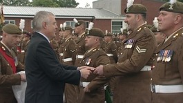 The First Minister presenting medals to troops