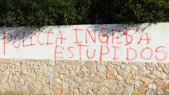 This graffiti was scrawled on a wall opposite the search site overnight.