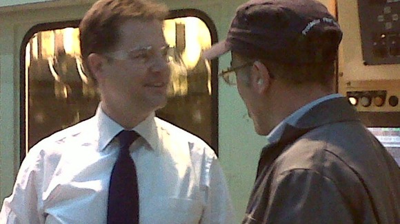 Deputy PM Nick Clegg talks to workers