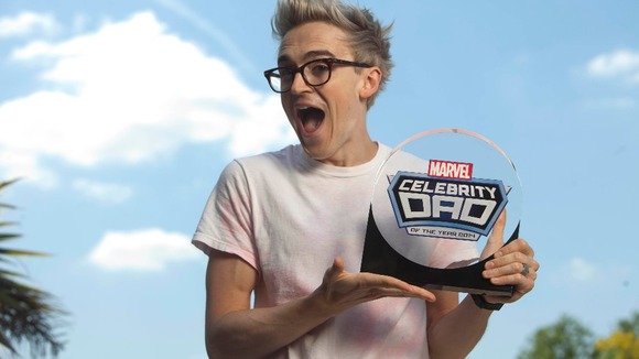 The star, who is currently touring with McBusted, shows off his award.