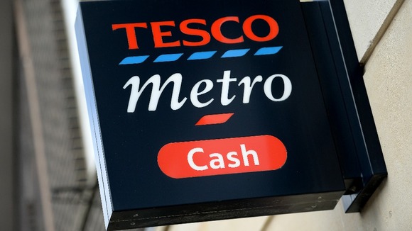Tesco is to remove an area of spikes from outside one of its stores after activists claimed they were "anti-homeless".