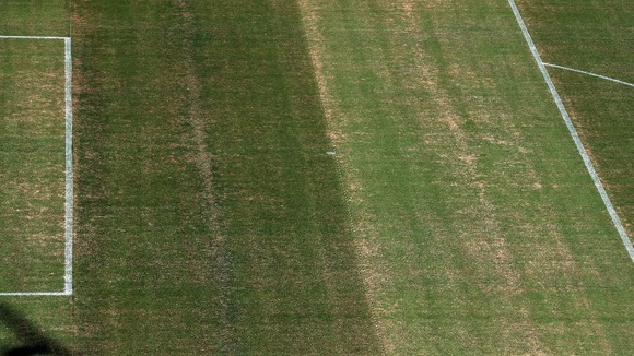 The patchy penalty area pictured only yesterday.