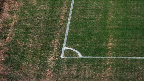 The corners o the pitch are also badly browned amid high temperatures.