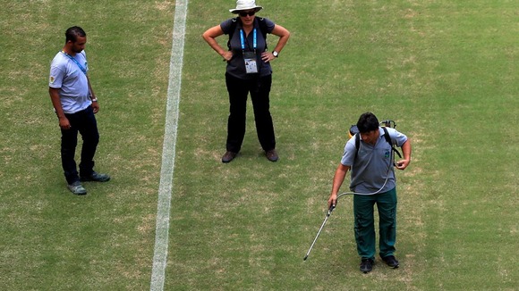 The Manaus pitch appears to be sprayed ahead of England v Italy on Saturday.