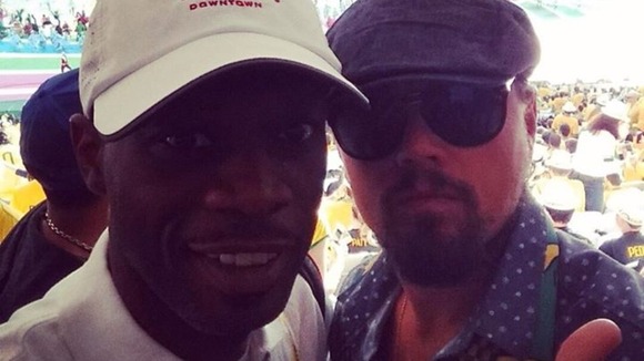 Former Fugees member Pras Michel and Leonardo Di Caprio at the game.