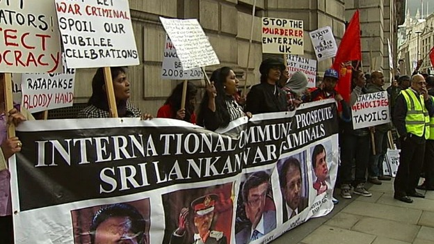 Protesters waving banners and placards.