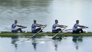 Four rowers in a boat.