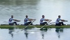 Four rowers in a boat.